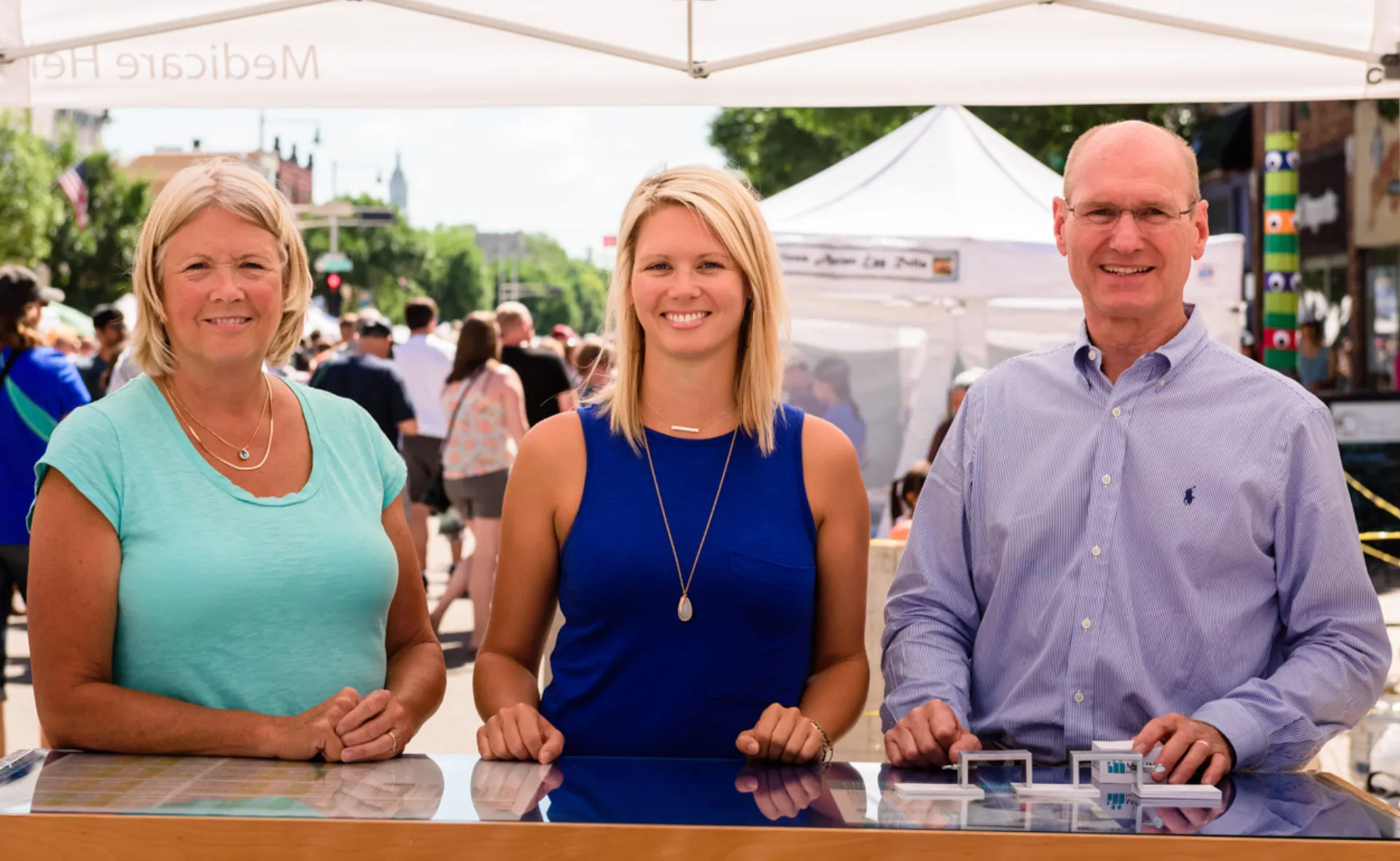 Pam Ulness, Marit Ulness and John Ulness at the Ulness Health booth